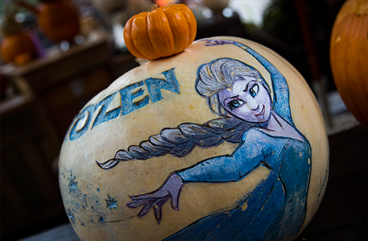 photo of pumpkins with Frozen themed decorations carved and painted on them