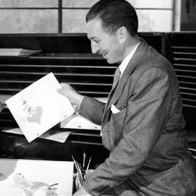 Walt Disney sitting with animators for Alice in Wonderland