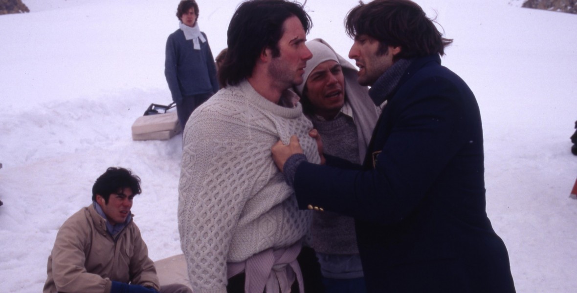 still from film Alive showing snowbound survivors struggling