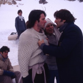still from film Alive showing snowbound survivors struggling