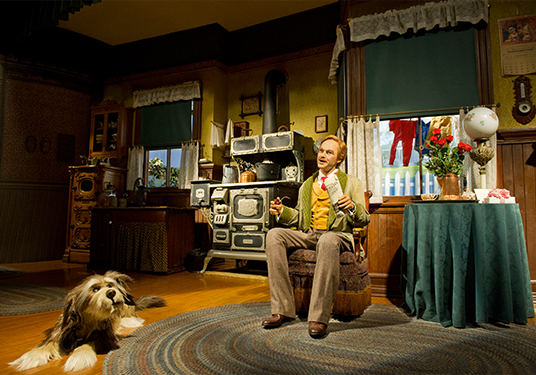 photo of model home with Audio-Animatronics-driven man and dog occupying kitchen