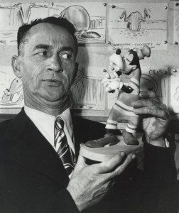 photo of Pinto Colvig holding a Goofy figurine