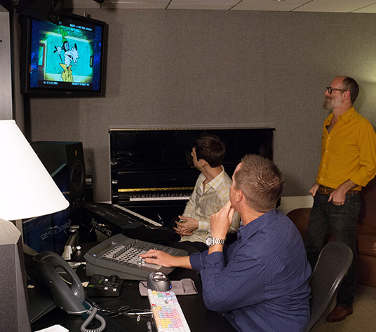 photo of Jay Stutler, Paul Rudish, and Christopher Willis creating music for Mickey Mouse shorts