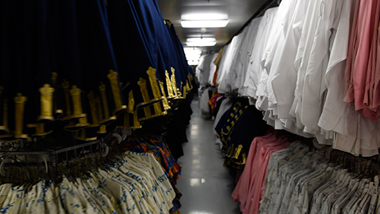 one aisle of a wardrobe department equipped to dress more than 1,400 crew members for service on the Disney Dream
