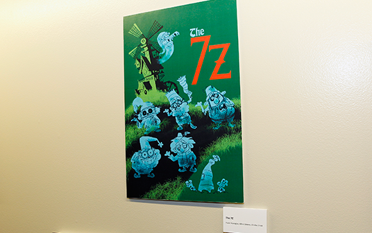 photo of a mounted illustration of seven ghostly Dwarf-like characters called The 7 Z