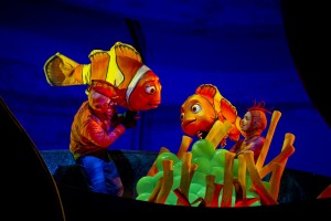 stage production photo of brightly costumed characters in Finding Nemo—the Musical