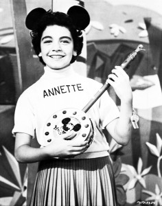 photo of young Annette Funicello wearing Mouseketeer cap and holding a banjo