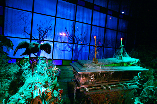 photo of crypt and  Audio-Animatronics® raven in Haunted Mansion attraction