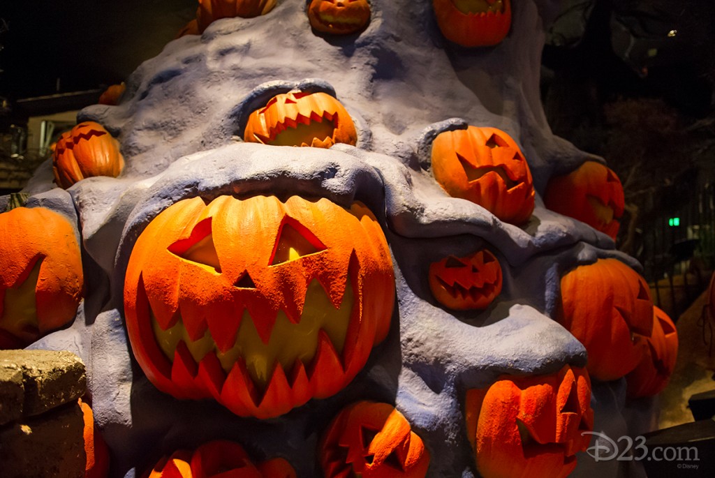 photo of grinning and grimacing Jack-O-Lanterns erupting out of a mound of purple frozen lava