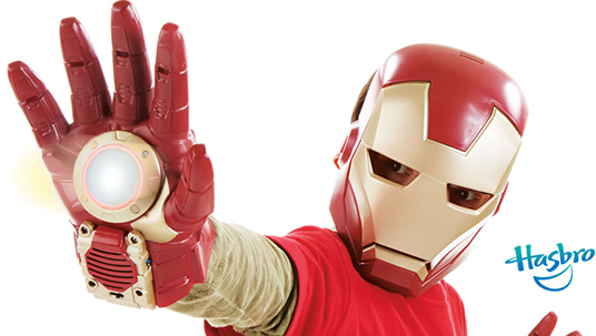 photo of child wearing Hasbro Iron Man glove and helmet