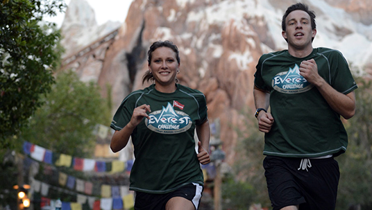 photo of man and woman jogging in Everest Challenge tee shirts