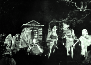 black and white photo of ghost players amidst tombstones from Disneyland's The Haunted Mansion