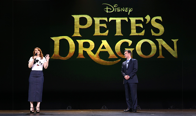 photo of Bryce Dallas Howard and Sean Bailey with banner for Disney Pete's Dragon