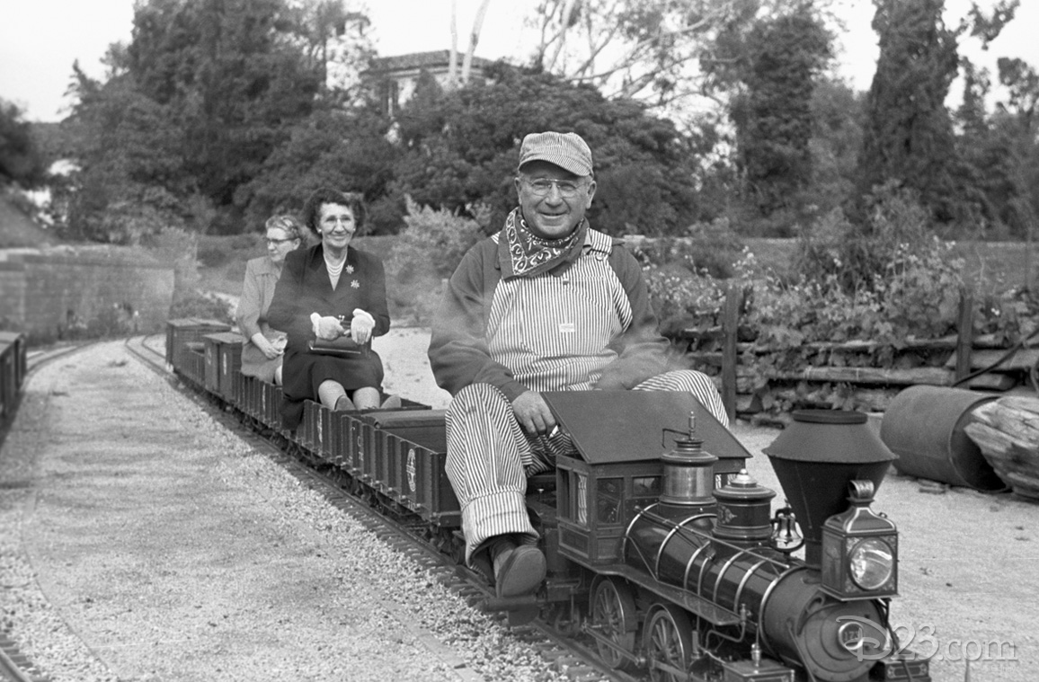 Walt’s friends enjoying a ride on the <i>Carolwood Pacific</i>, the 1/8-scale model railroad he created for the back yard of his Carolwood home.