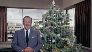 Walt Disney with a Christmas tree