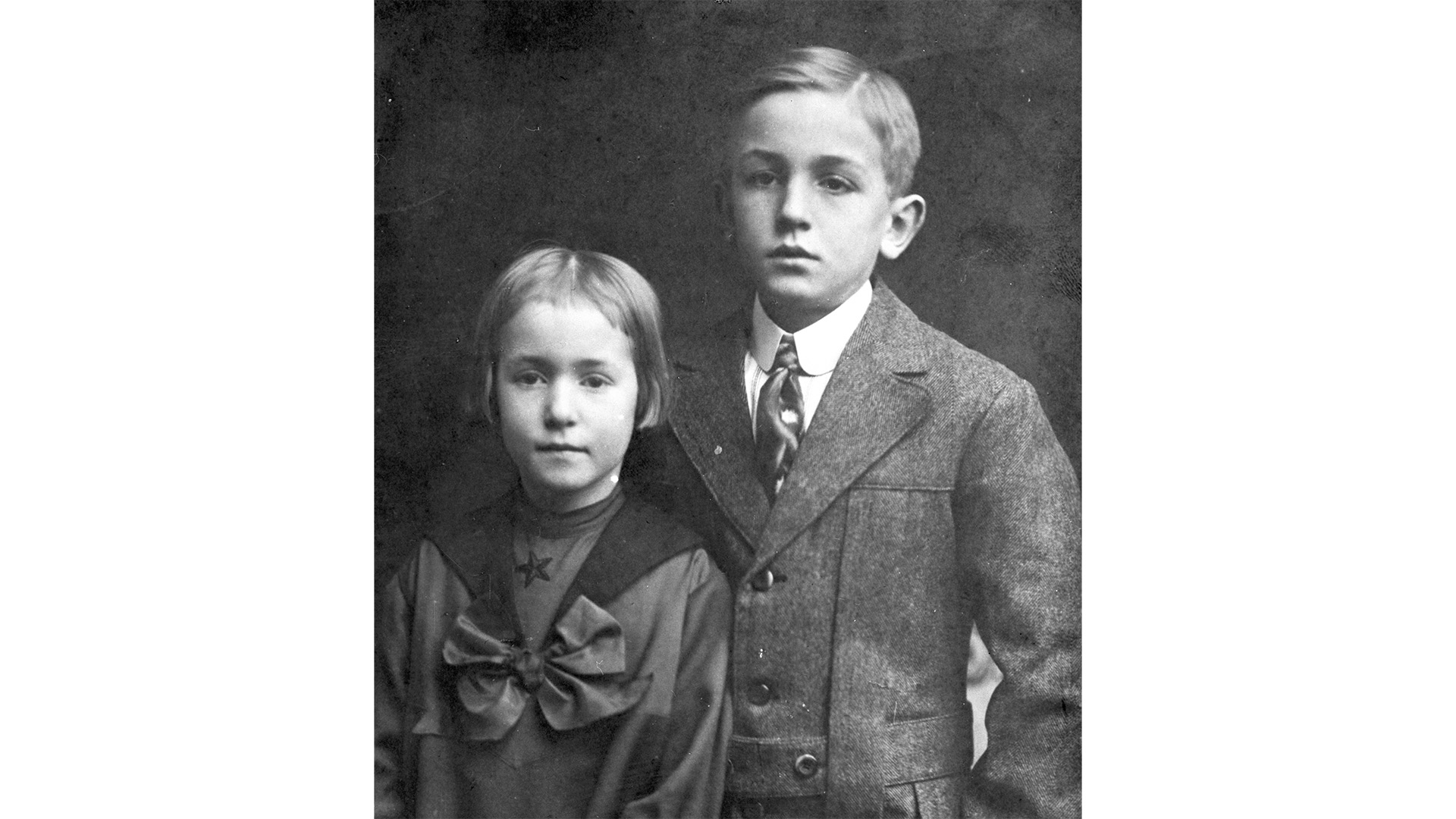 A young Walt Disney with a family member.