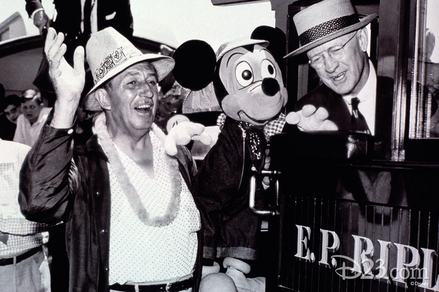 Walt Disney waiving along side Mickey Mouse and the E.P. Ripley.