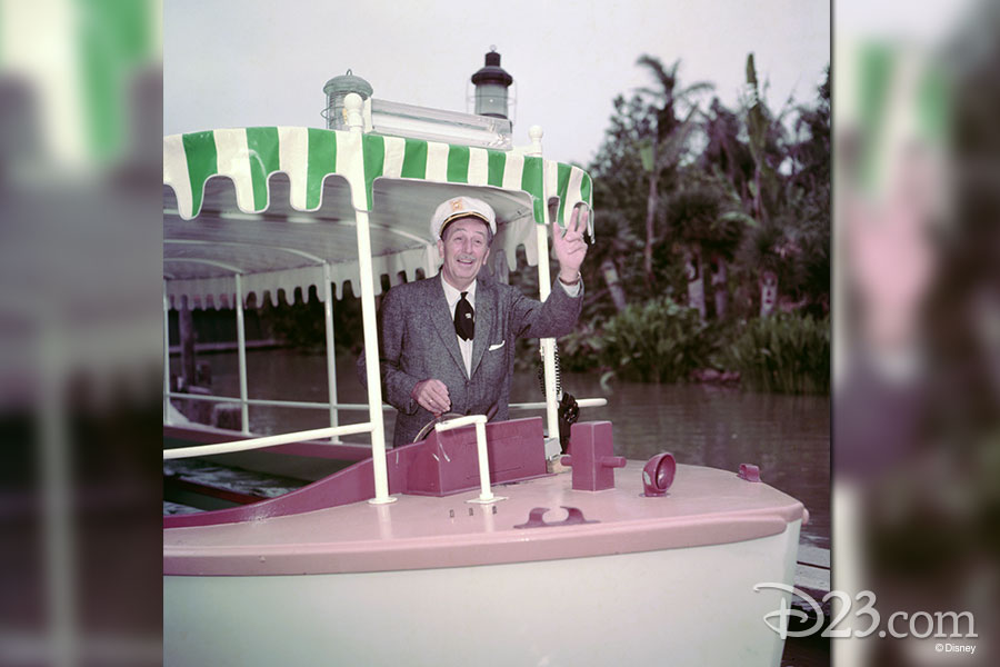 Walt Disney waiving to the camera while on the Jungle Cruise