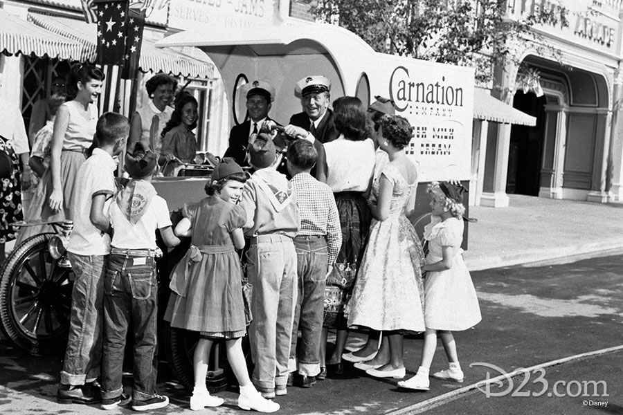 Walt Disney entertains kids while driving a truck on Main Street.