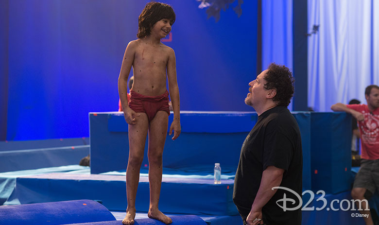 Neel Sethi and Jon Favreau on set