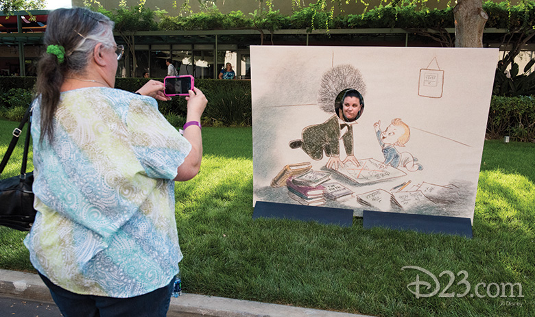 Guests taking pictures at a photo spot at The Reluctant Dragon 75th Anniversary On the Lot