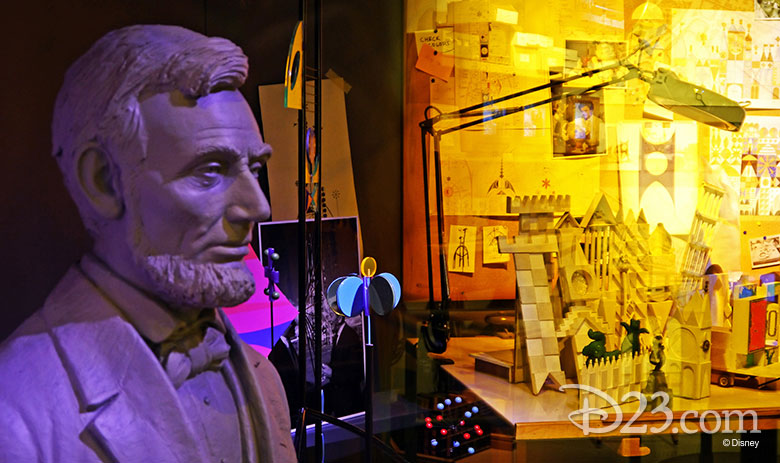 A bust of president Abraham Lincoln among a display of 1960s WED Enterprises (now Walt Disney Imagineering) materials.