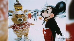 Winnie the Pooh and Mickey Mouse play in the snow