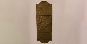 Mickey counterfeit brass sign