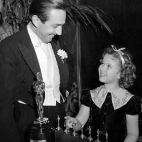 Walt receiving an Academy Award for Snow White and the Seven Dwarfs