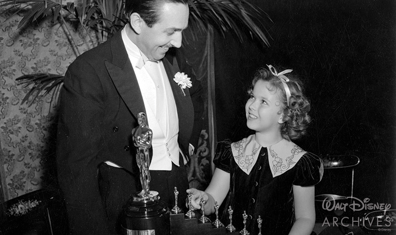 Walt receiving an Academy Award for Snow White and the Seven Dwarfs