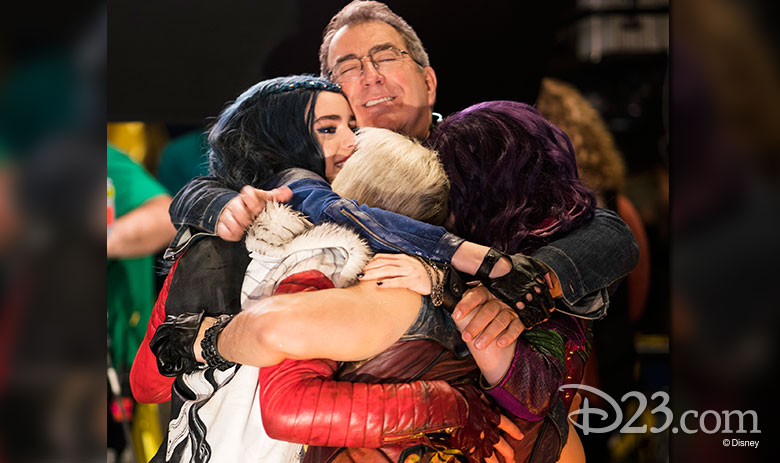 Kenny Ortega and the Descendants 2 cast hugging