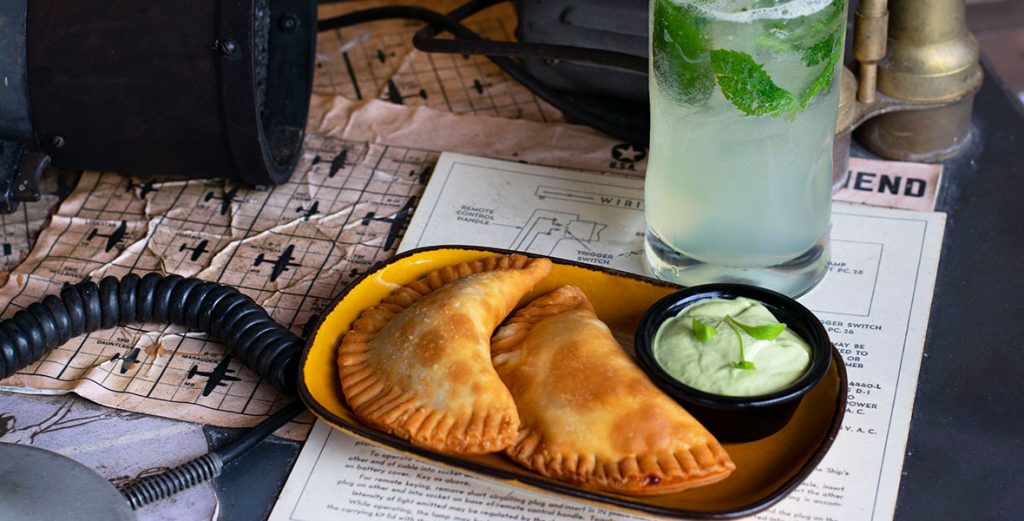 Satipo&rsquo;s Empanadas and Poisonless Dart drink from Jock Lindsey&rsquo;s Hangar Bar