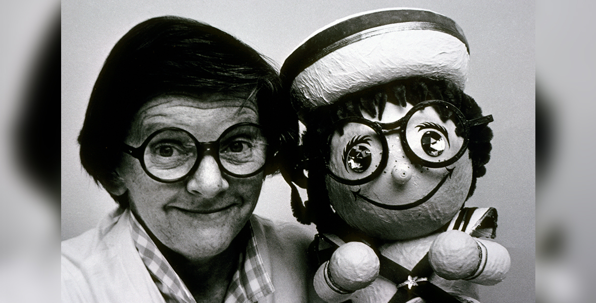 Joyce Carlson with posing with a remarkably similar &ldquo;it&rsquo;s a small world&rdquo; doll.