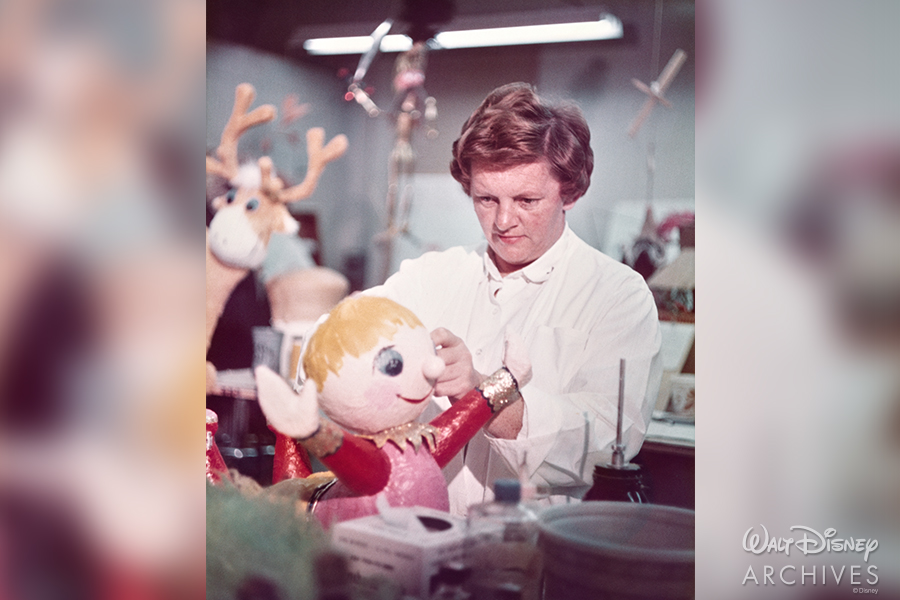 Joyce working on an “it’s a small world” doll.
