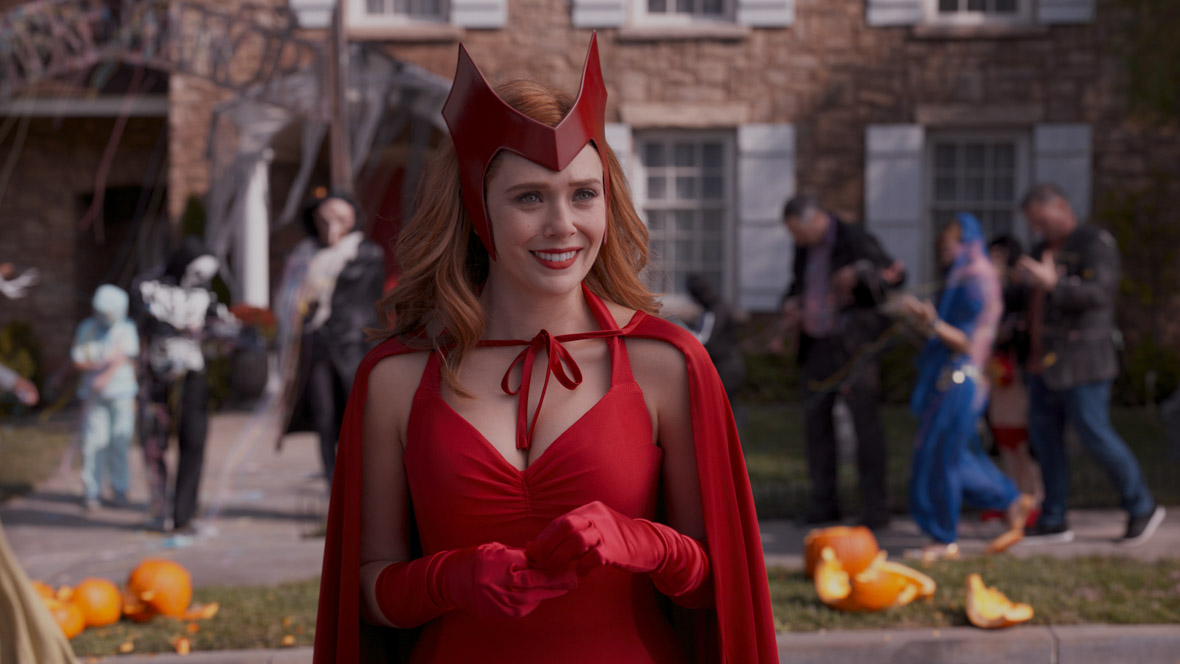 Wanda Maximoff, aka the Scarlet Witch, dressed in her Halloween costume from the Disney+ Original Series, WandaVision.