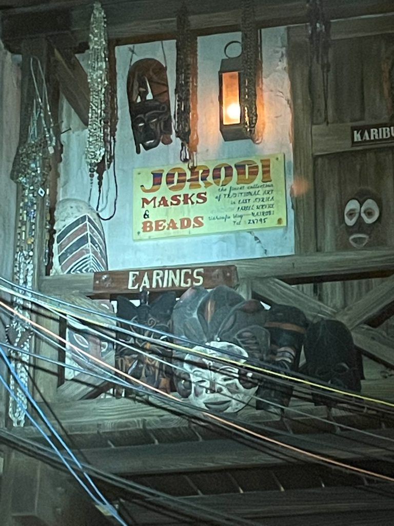 A wall at Disney's Animal Kingdom with Jorodi masks on it.