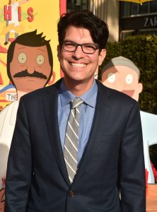 Dan Mintz, who voices Tina Belcher in The Bob’s Burgers Movie, smiles on the red carpet at the world premiere.