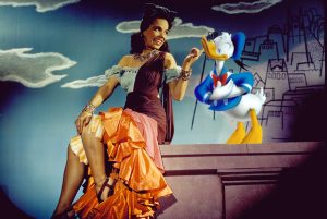 Animated Donald Duck getting his chin scratched by live action Brazilian actress and singer, Aurora Miranda.