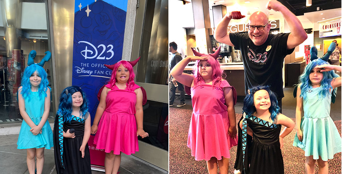 Head of D23 Michael Vargo poses with three young fans dressed as Pain, Hades, and Panic from the film Hercules.