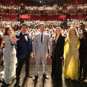 Stars Adam Hugill, Xochitl Gomez, Benedict Wong, Benedict Cumberbatch, Elizabeth Olsen, Rachel McAdams, and Sheila Atim pose on stage at the Doctor Strange in the Multiverse of Madness world premiere at the Dolby Theatre in Hollywood, California, on Monday, May 2, 2022.