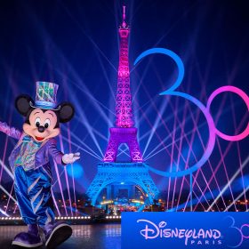 Mickey Mouse helps light up the Eiffel Tower with iridescent lights as part of the 30th anniversary of Disneyland Paris)
