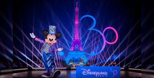 Mickey Mouse helps light up the Eiffel Tower with iridescent lights as part of the 30th anniversary of Disneyland Paris)