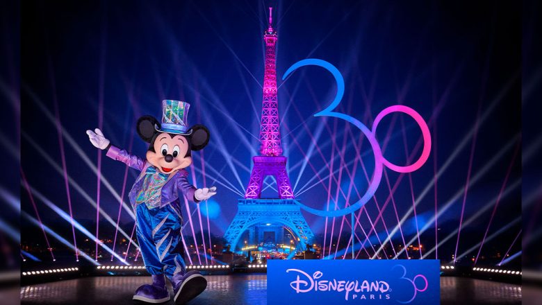 Mickey Mouse helps light up the Eiffel Tower with iridescent lights as part of the 30th anniversary of Disneyland Paris)