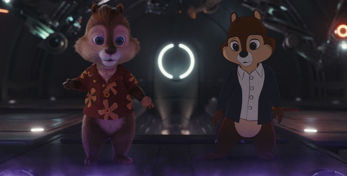 Animated chipmunks, Chip, wearing a leather bomber jacket, and Dale, wearing a bold Hawaiian print shirt gaze down in a mysterious bunker while trying to find their friend.