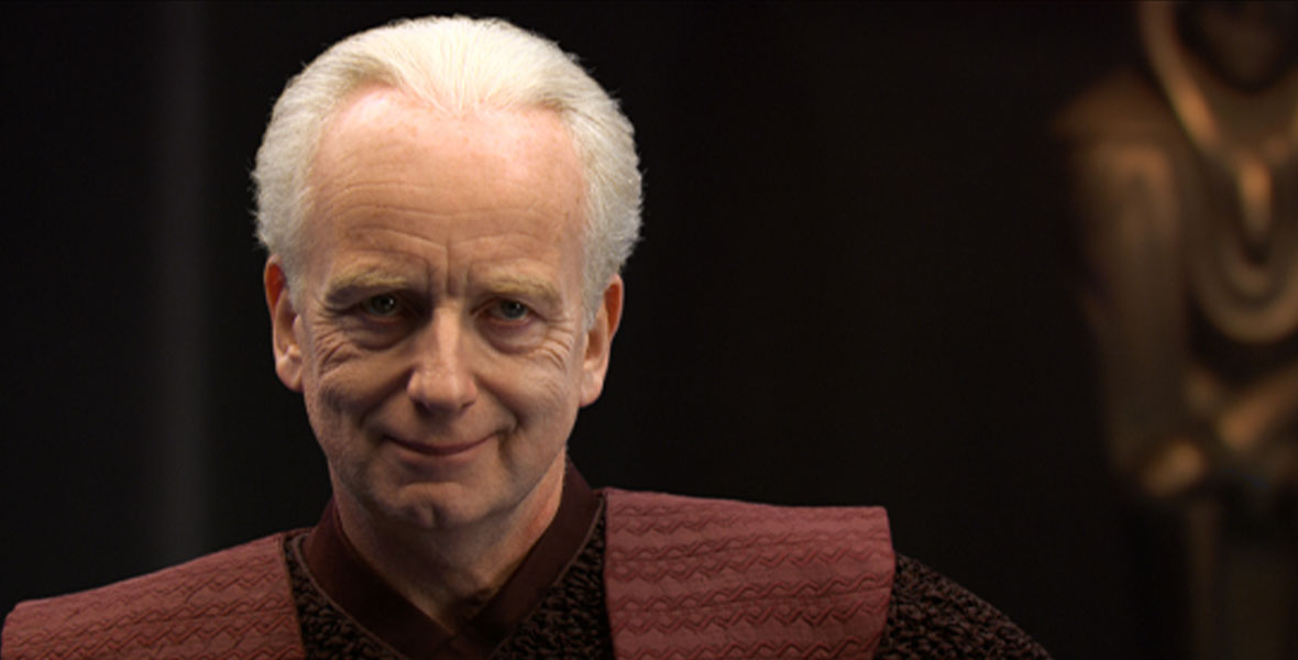 Supreme Chancellor Palpatine (Ian McDiarmid) smiles sinisterly at the camera in Star Wars: Revenge of the Sith