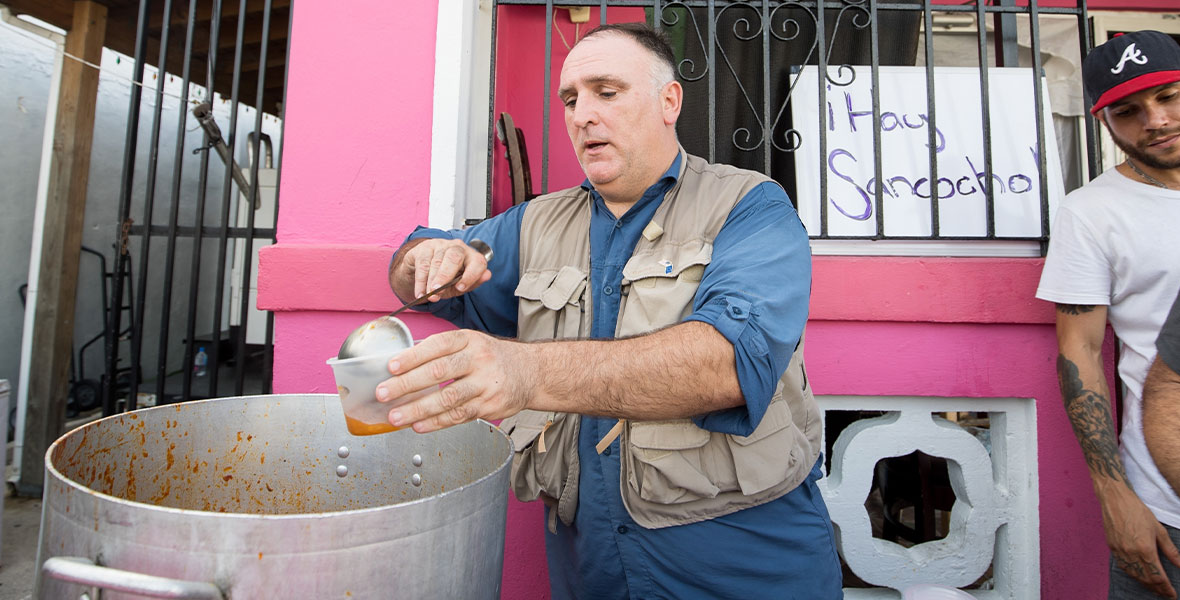 José Andrés (L) pours sancocho into bowls for locals after Hurricane Maria in Puerto Rico in the documentary film We Feed People.