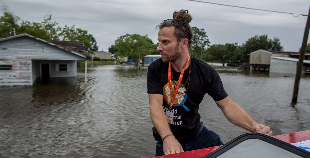 World Central Kitchen Director of Field Operations, Sam Bloch, with an amphibious vehicle delivering meals in Baton Rouge after Hurricane Barry in the documentary film We Feed People.