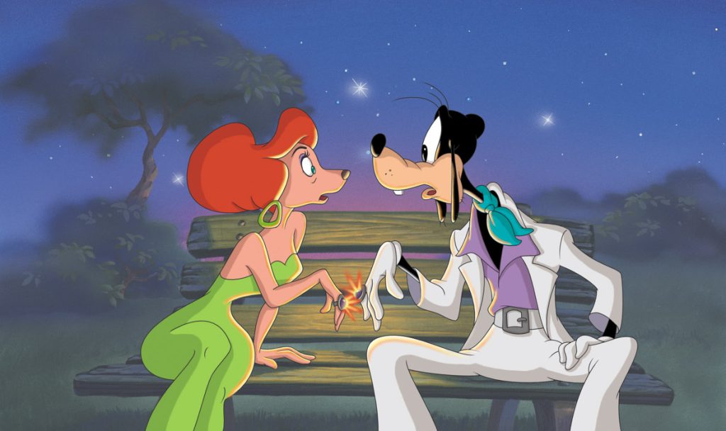 Sylvia and Goofy sit on a bench outside, at night, in a still from An Extremely Goofy Movie. Sylvia has red hair and is wearing a green strapless dress with green earrings; Goofy is wearing a white leisure suit with a purple shirt and green neck scarf. Their mood rings are touching and setting off a spark.