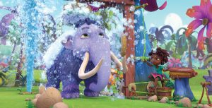 A large purple woolly mammoth stands under a shower head and is surrounded by bubbles. A young girl operates the shower while standing on a stool in Disney Junior’s animated series Eureka!