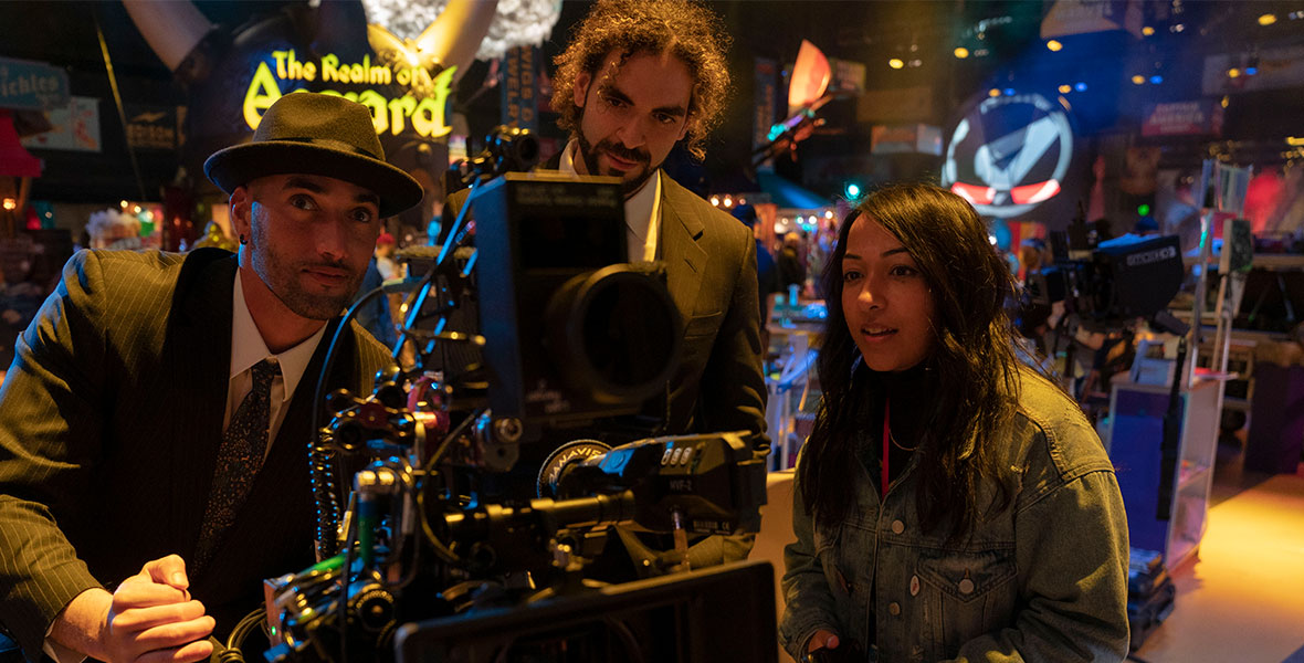 From left to right, Directors Adil El Arbi and Bilall Fallah, and Executive Producer Sana Amanat work behind the scenes of Ms. Marvel at night.